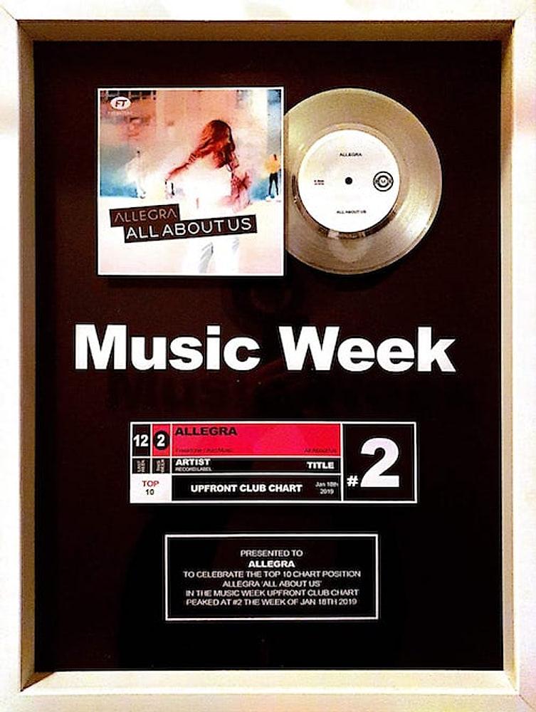Framed Music Week award for Allegra, All About Us, reaching number 2 on the Upfront Club Chart