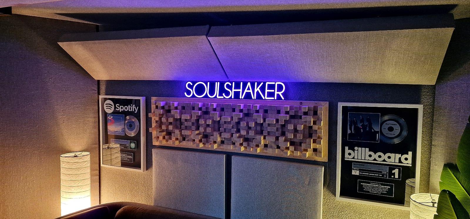 The studio with the Soulshaker neon sign and framed plaques