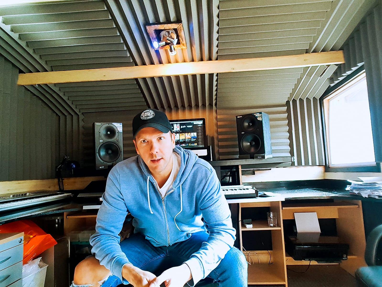 Matt sitting in the studio in a cap