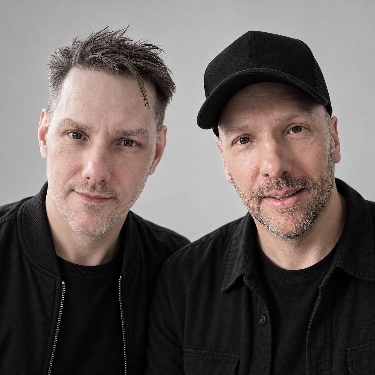 Matt and Warren against a pale grey wall