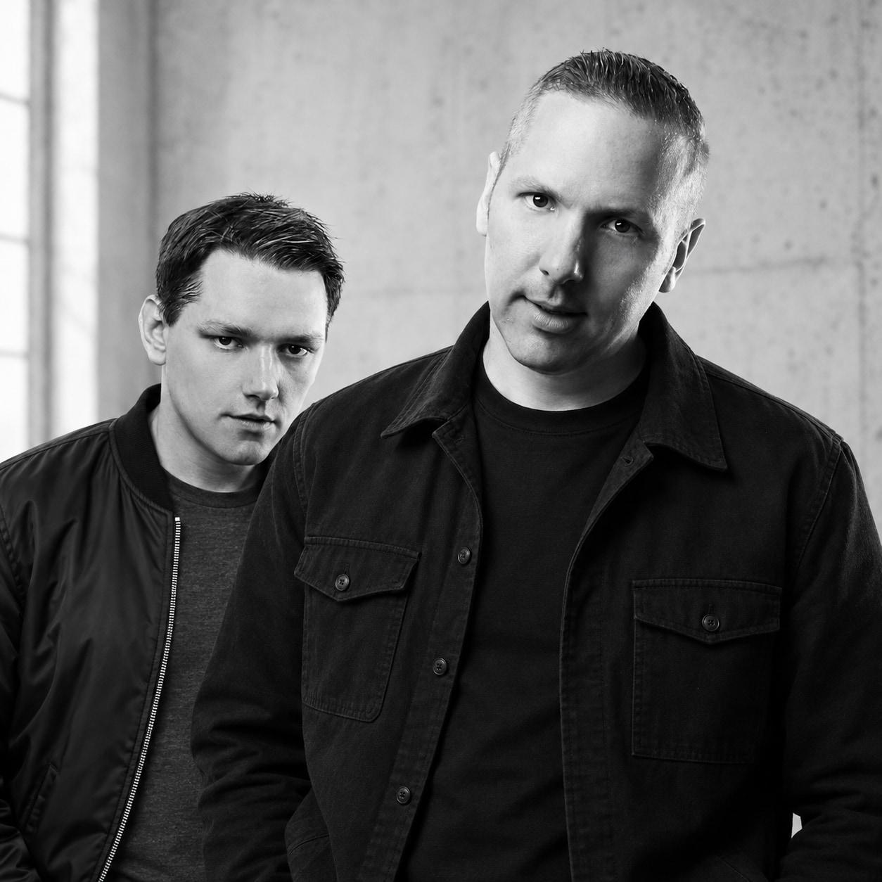 Matt and Warren Meyers of Soulshaker, black and white portrait against concrete